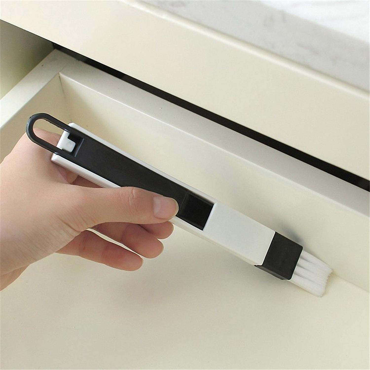 Cleaning brush for keyboard and window frame