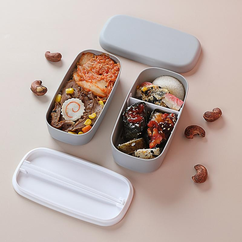 Caixa de comida com camadas duplas e pauzinhos