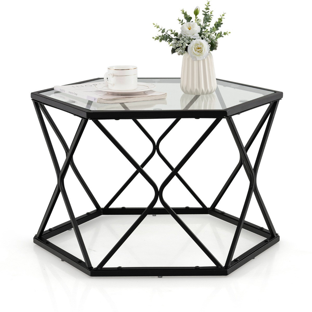Mesa de centro com tampo hexagonal de vidro temperado e pés de metal.