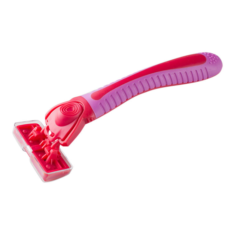 Razor with replaceable blades in a storage box - Red